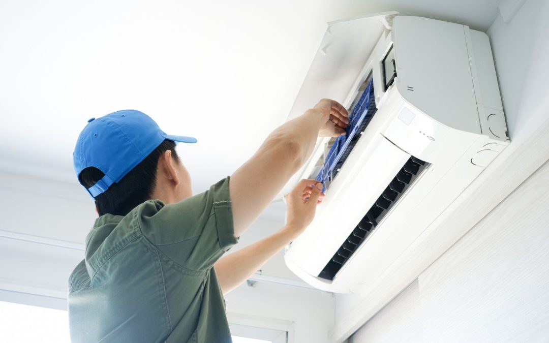 HVAC technician servicing a ductless mini split in El Dorado Hills
