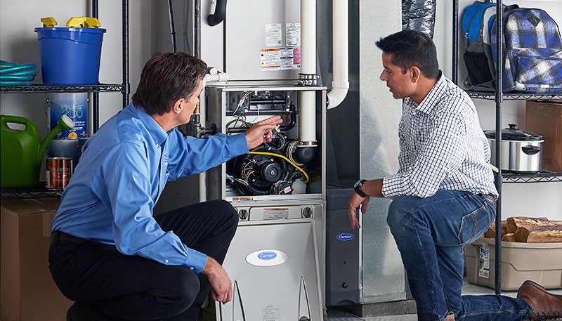 Technician evaluating a furnace for repair or replacement in El Dorado Hills