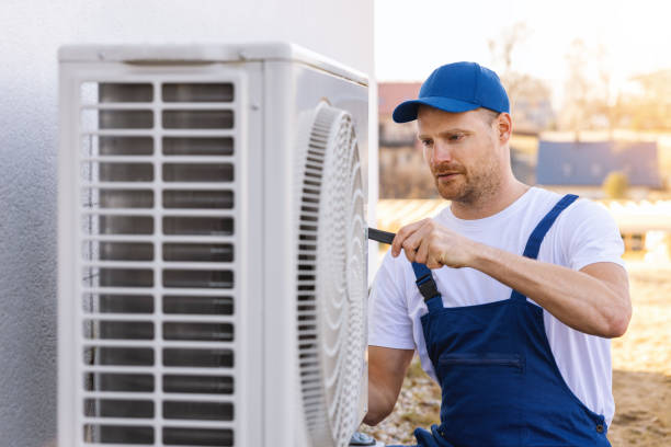 HVAC technician servicing an outdoor air conditioner in El Dorado Hills