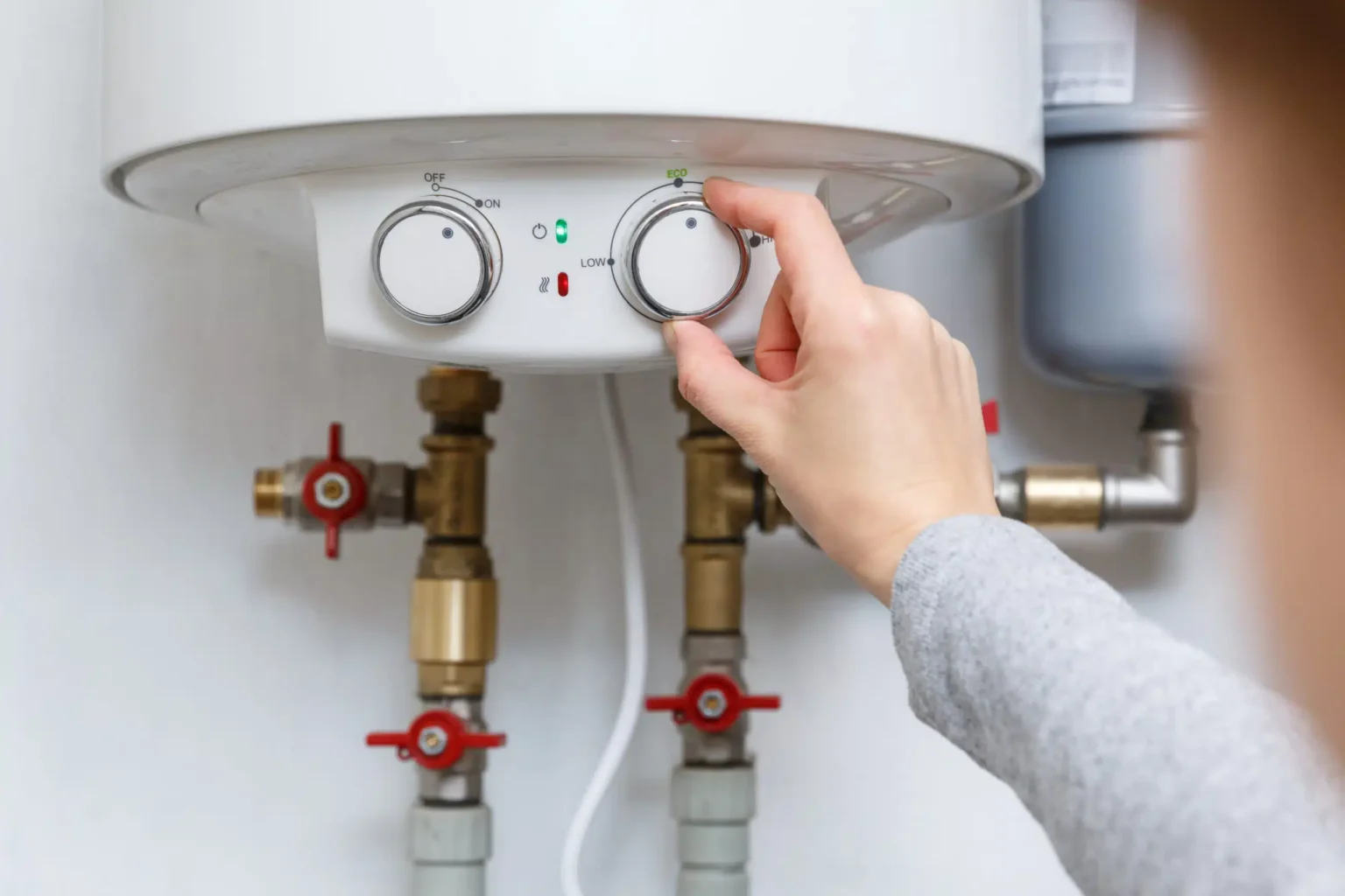 Technician adjusting a water heater in El Dorado Hills