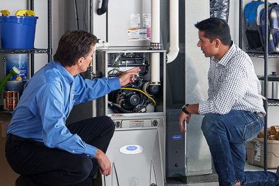 Technician evaluating a furnace for repair or replacement in El Dorado Hills